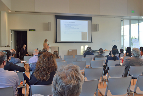 Audience members watch a presentation at the February 28, 2022 community presentation