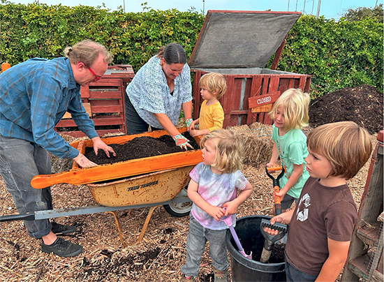WRLC students working with compost